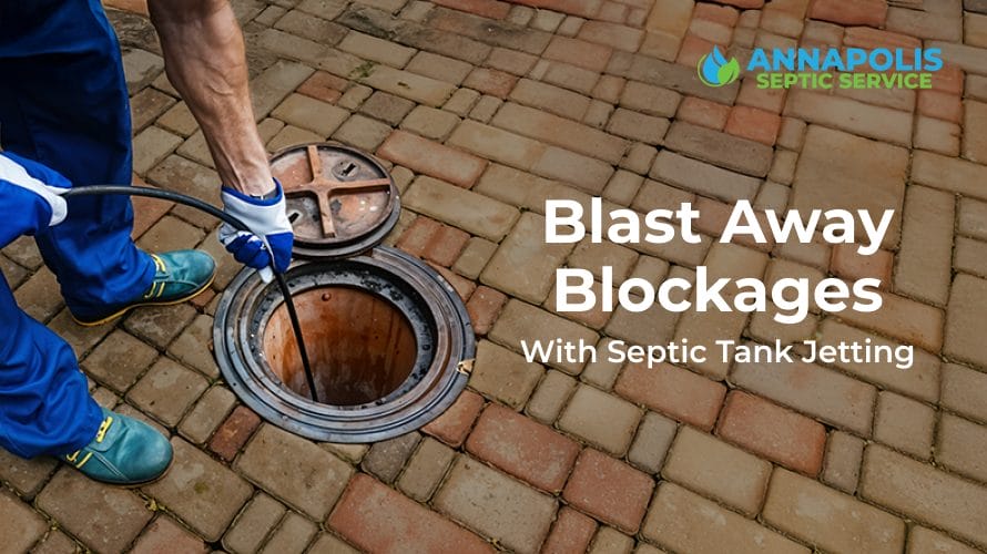 Septic technician using jetting equipment to clean clogged septic lines