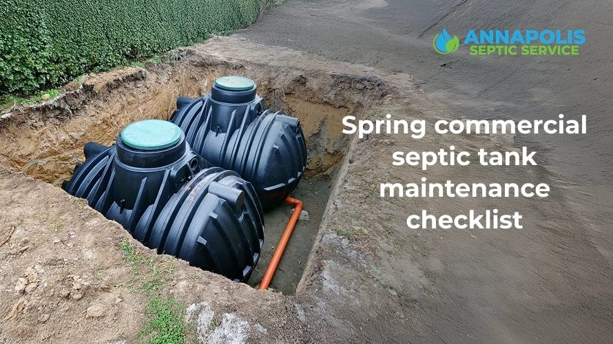 Technician inspecting a commercial septic tank during spring maintenance